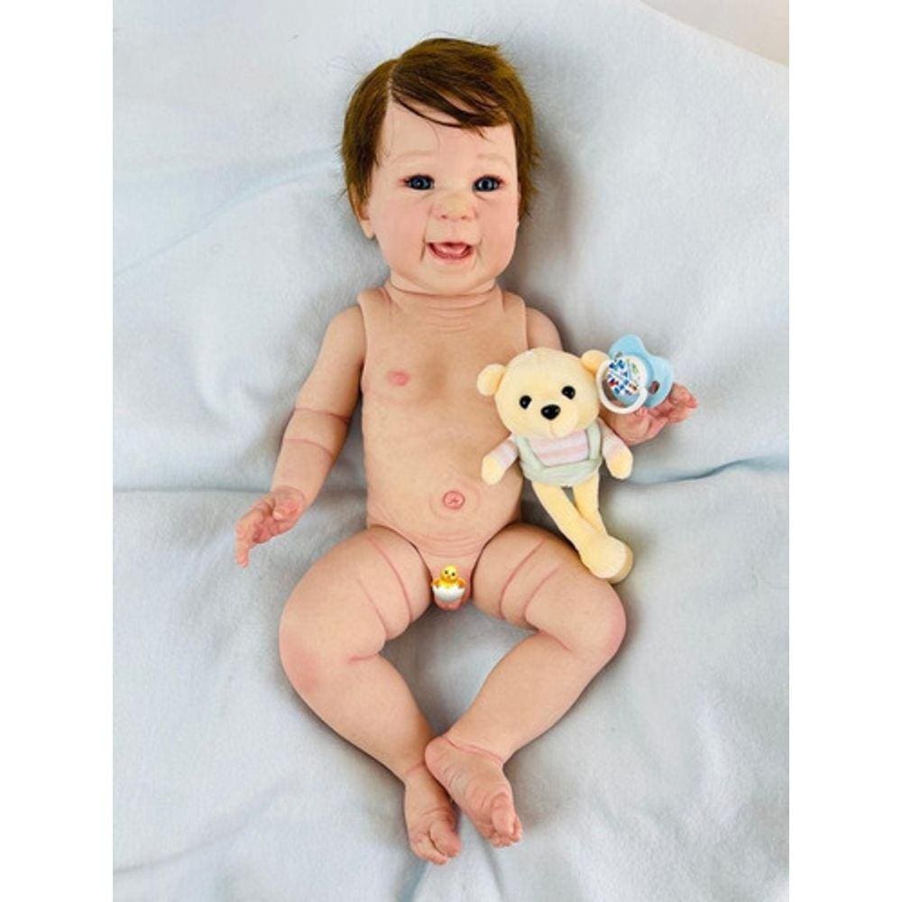 Boneco Bebê Reborn Menino Em Silicone Moreno Olho Azul 55 Cm no