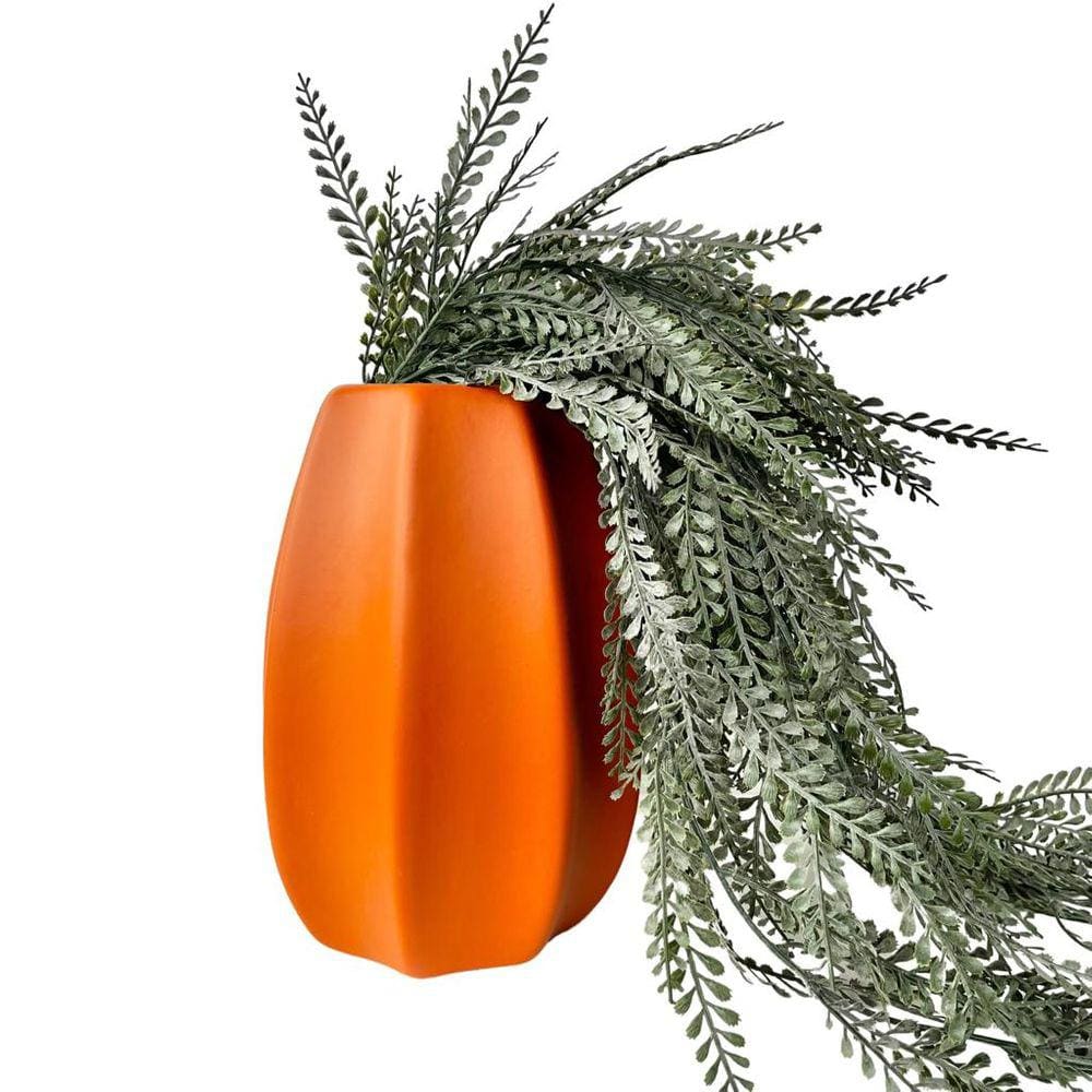 Vaso centro de mesa laranja moderno com planta caída