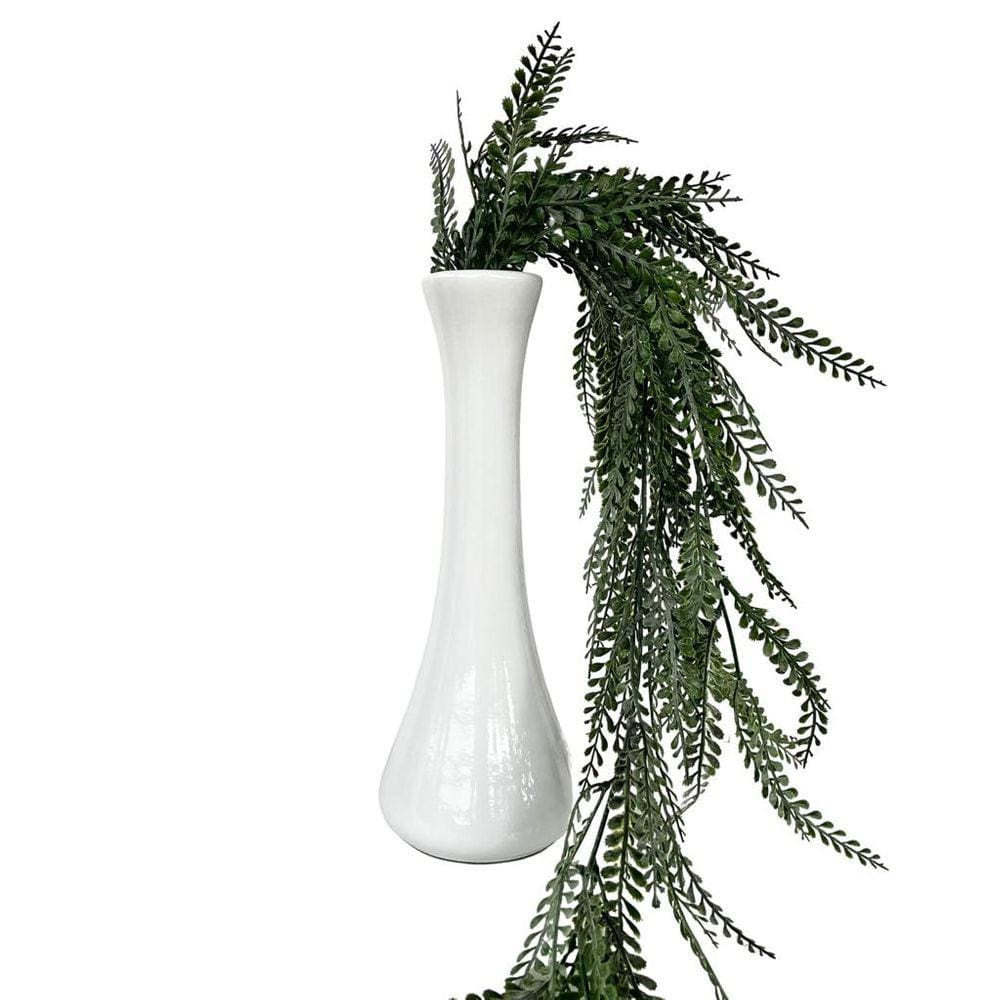 Decoração sala quarto vaso solitário branco com planta caída